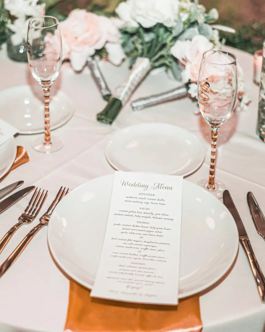 A table set with plates and silverware on top of it.