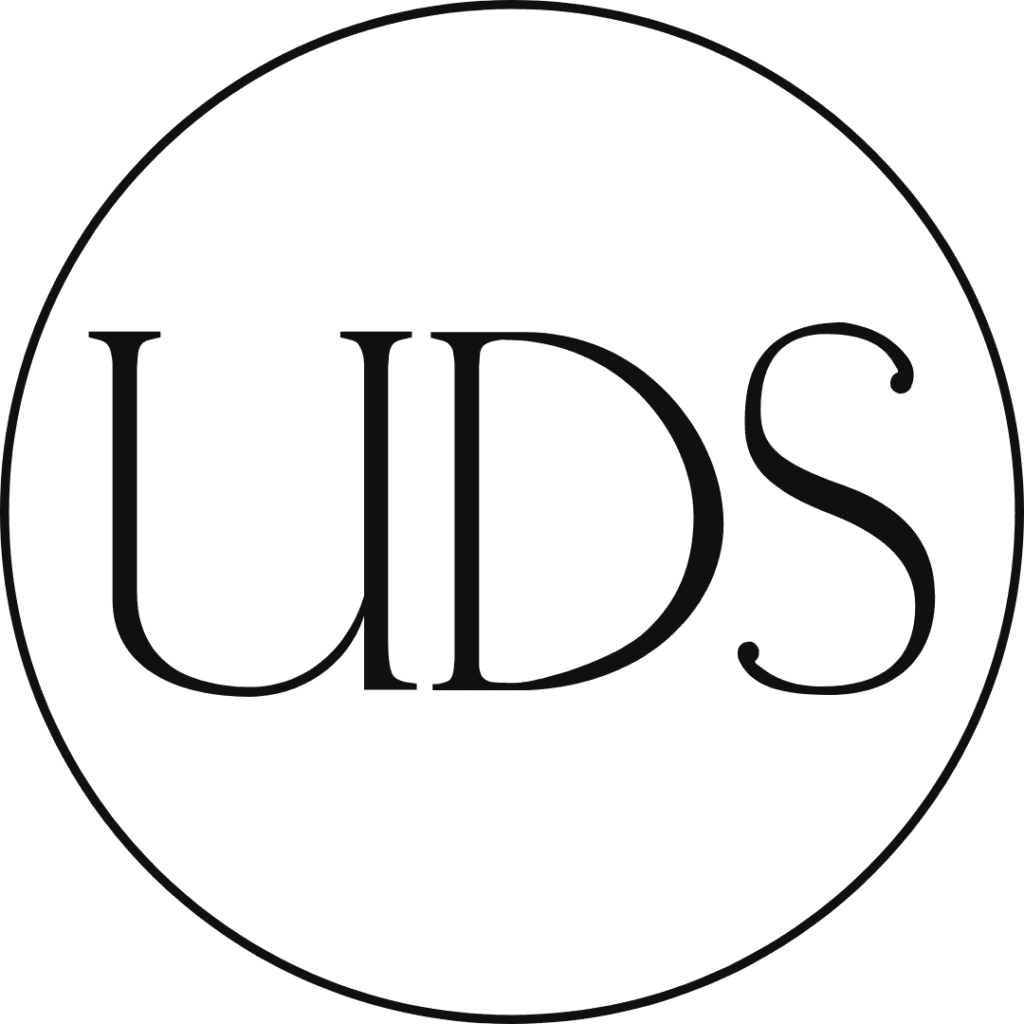 A black and white logo of uds