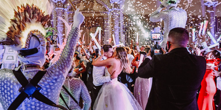 A couple is dancing in front of the crowd.