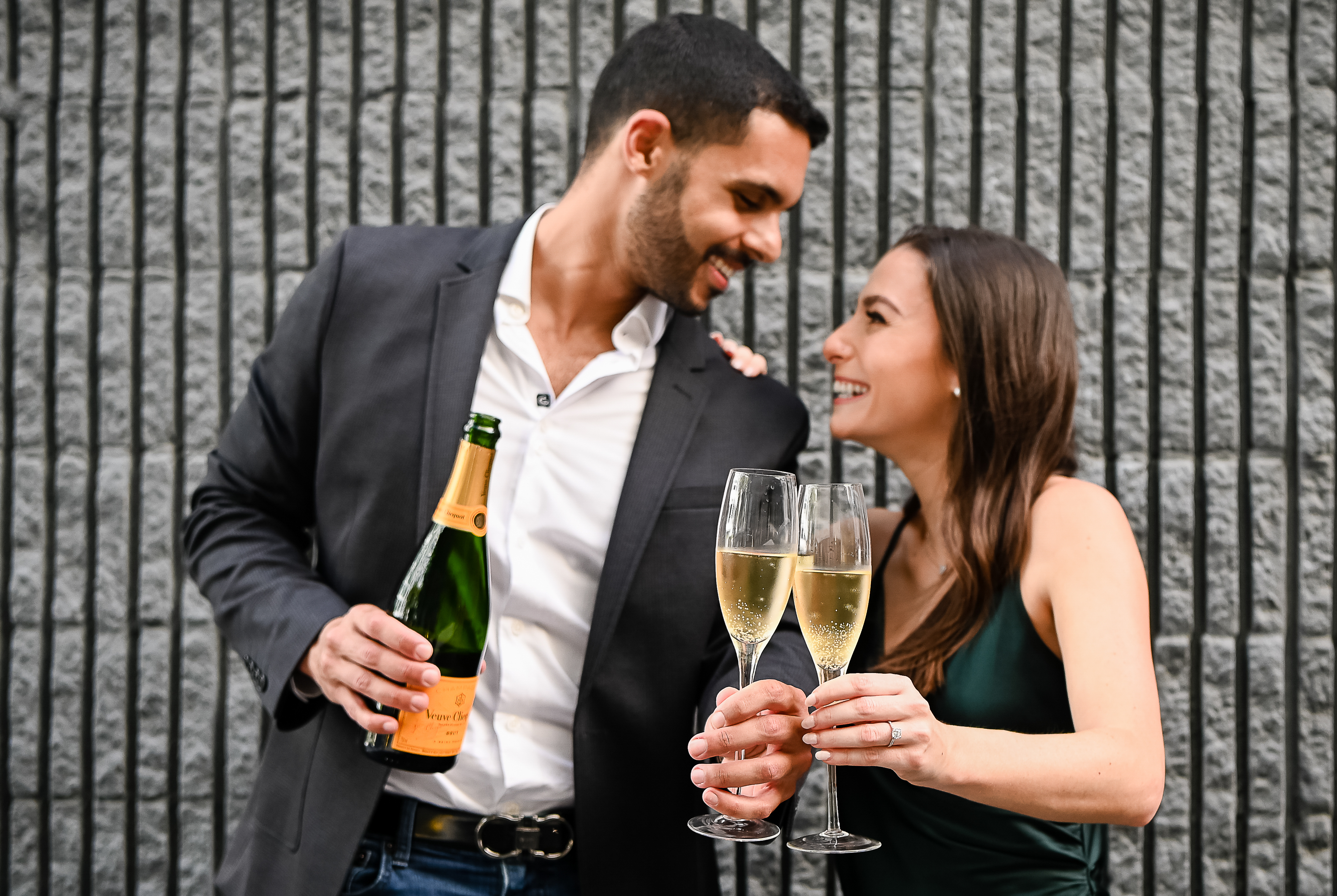 A man and woman holding champagne glasses.